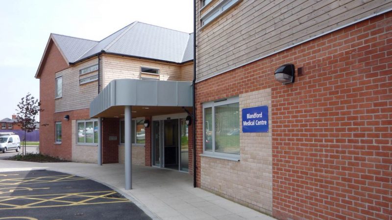 The image shows the entrance to Blandford Medical Centre